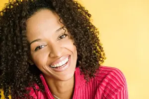 Colored Background Prints: Portrait of a young woman smiling