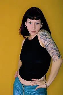 Tattoo Prints: Portrait of a young woman with tattoos on her arms