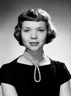 Proud Prints: Portrait of young woman wearing pearl necklace