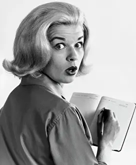Facial Expression Prints: Portrait of a young woman writing in a diary