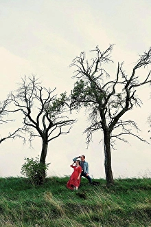 Reality Prints: Pregnant couple looking out from hillside