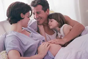 4 5 Years Prints: Pregnant woman with her husband and her daughter