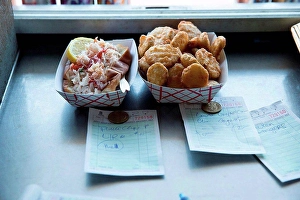 Invigorating Prints: Prepared food by hatch in fast food trailer