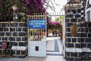 Traditional Prints: Present day entrance to the historic village of Capernaum with a sign saying Capharnaum the town of Jesus';