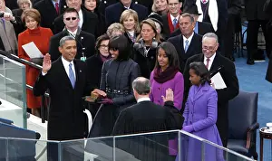Dennis Brack Prints: President Barack Obama takes the oath of office from Chief Justice John Roberts with First Lady Michelle Obama