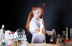 Lighted Prints: Pretty chemist working with chemicals in laboratory, close-up