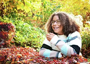 Sweaters Prints: Pretty tween girl laughing outdoors in fall colors