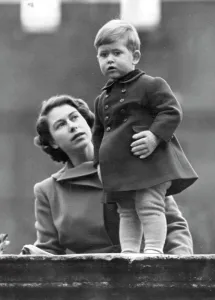 1950 Prints: The Princess Watches As Queen Juliana Visits The City -- Warmly wrapped little Prince Charles