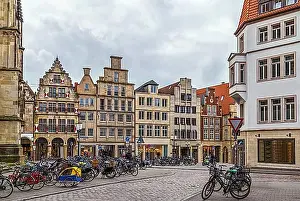 Exterior Photographs Prints: Prinzipalmarkt is historic street with buildings with picturesque pediments attached to one another in Munster