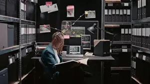 Case Prints: Private investigator reviewing new case evidence