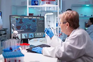 Analysis Prints: Professional doctor scientist looking in computer for medical experiment