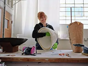 Manual Worker Prints: Professional female sculptor working with plaster in her studio