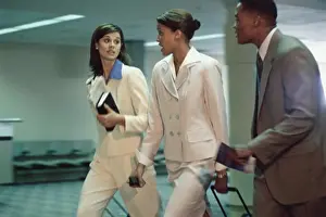 Business Travel Prints: Side profile of business executives walking together