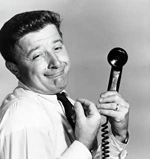 Facial Expression Prints: Side profile of a businessman holding a telephone receiver making a face