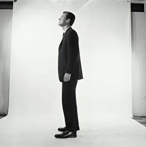 Business Suit Prints: Side profile of businessman standing