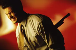 Knife Prints: Side profile of a man stabbed in the back