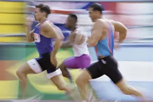 Sports Race Prints: Side profile of three men running on a running track