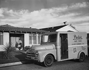 Letter Prints: Side profile of a milk truck parked in front of a house, California, USA, 1950