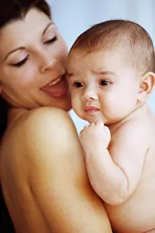 Staring Prints: Side profile of a mother holding her baby boy in her arms