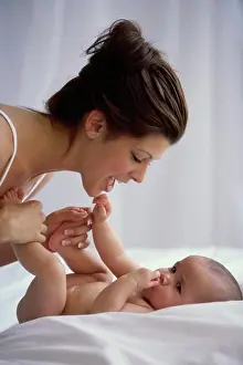 Beginnings Prints: Side profile of a mother playing with her baby boy