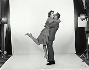 Suit Prints: Side profile of a young couple embracing each other