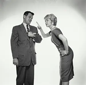 Shirt And Tie Prints: Side profile of a young woman pointing her finger at a young man