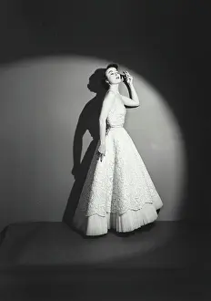 Gown Prints: Side profile of young woman posing