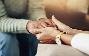 Kindness Prints: Psychologist, woman and holding hands for support