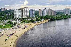Townscape Prints: Punta Negra Beach in front of Manaus skyline, Amazonia State, Brazil, South America