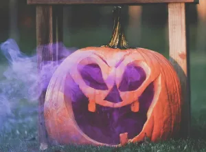 Room For Text Prints: Purple smoke in Jack o Lantern pumpkin face for Halloween holiday
