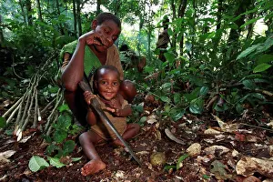 Knife Prints: Pygmy Baaka child playing with a machete Cameroon