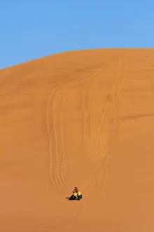 Wheel Prints: Quad bike on sand dunes between Swakopmund and Walvis Bay, Namibia, Africa