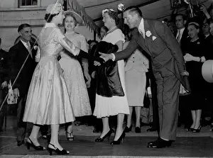 Her Majesty Prints: Queen Attends Friend's Wedding Reception -- The Queen is received on arrival at Hutchinson House
