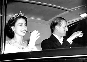 Mode Of Transportation Prints: The Queen and the Duke of Edinburgh acknowledge the cheers of the crowds as they drives away from the Odeon Leicester