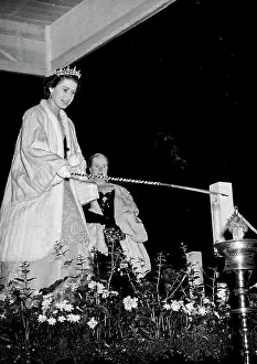 Her Majesty Prints: The Queen Lights A Beacon. Her Majesty lighting the beacon in Holyrood Park