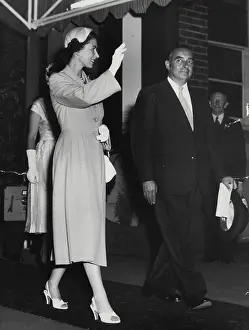 Her Majesty Prints: Queen and Mr. Landa leaving Central last night. February 13, 1954