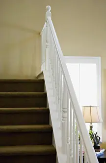 Stairway Prints: Railing along carpeted staircase