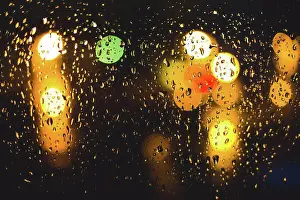 Weather Prints: Rain drops on window. Peaceful evening or night at home when raining outside
