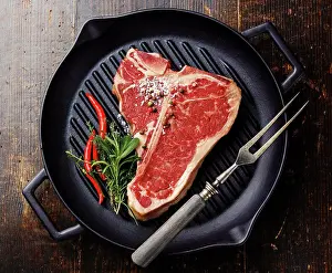 Ingredient Prints: Raw fresh meat T-bone steak on grill iron pan