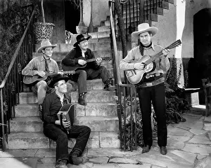 Movies Prints: Ray Whitley (standing, acoustic guitar) and the Six Bar Cowboys