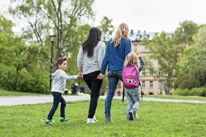 Sons Prints: Rear view of female homosexual family walking in park
