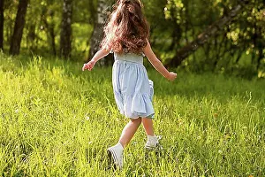 Runner Prints: Rear view girl running park