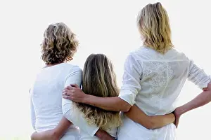 10 11 Years Prints: Rear view of a girl standing with her mother and grandmother