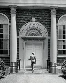 Rail Prints: Rear view of a man entering a bank