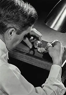Work Tool Prints: Rear view of a man repairing a pocket watch