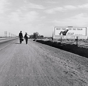 1937 Prints: Rear View of Two Men Walking toward Los Angeles