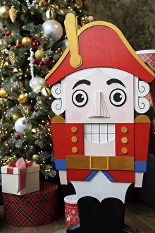 Holidays Prints: Red nutcracker near the tree