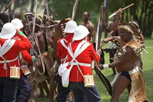 Outdoor Africa Prints: Reenactment of British soldiers and Zulu warriors fighting