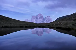Ponds Prints: Reflection of Pelmo mountain in the Baste lake during blue hour