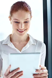 Redhead Prints: Report, smile and tablet with business woman at glass window in office for online research